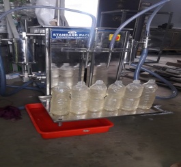 VOLUMETRIC LIQUID FILLING MACHINE.